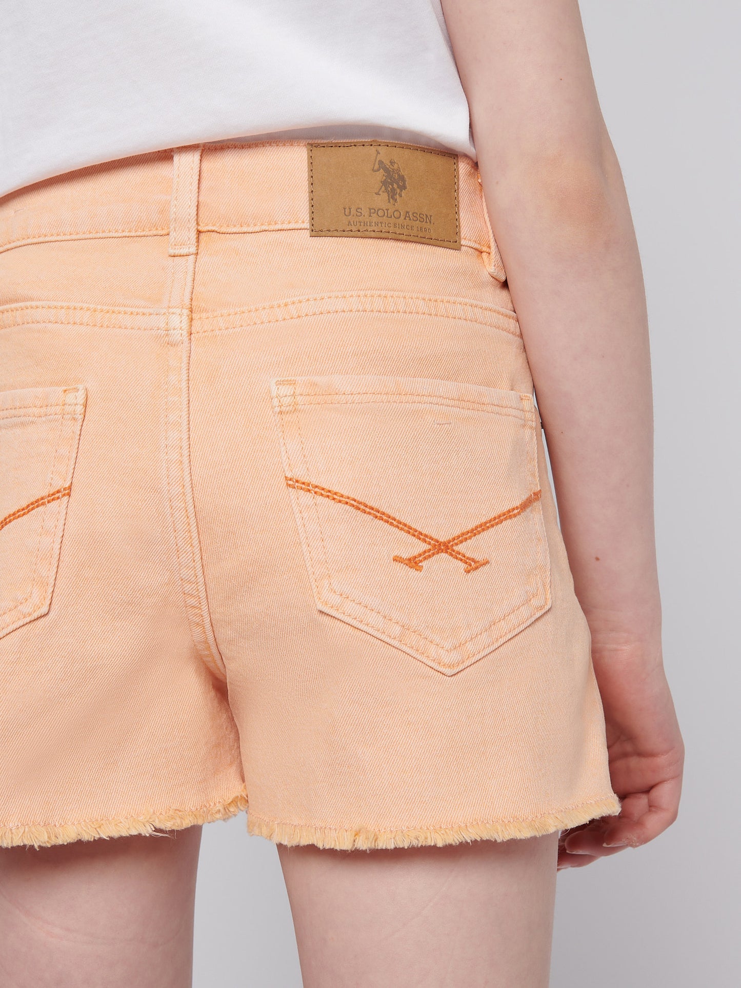 Girls Wash Denim Shorts in Peach Nectar