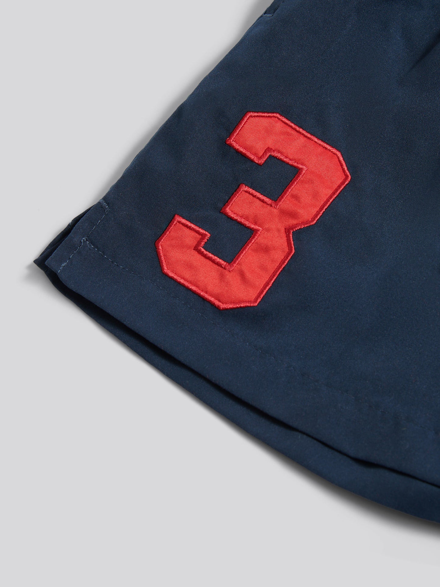 Boys Player 3 Swim Short in Dark Sapphire Navy / Haute Red DHM