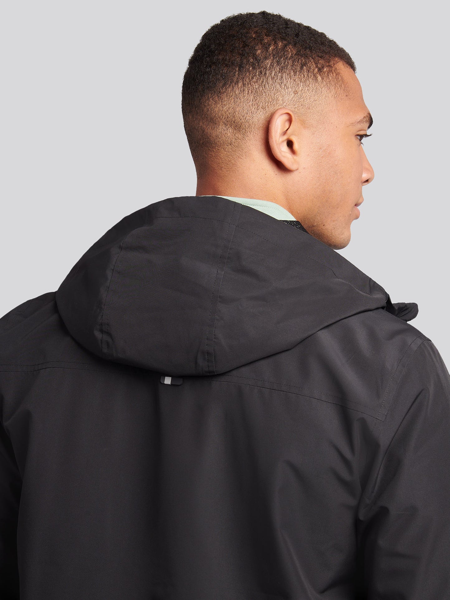 Men's Hooded Windbreaker in Black/White – zip and pocket detail