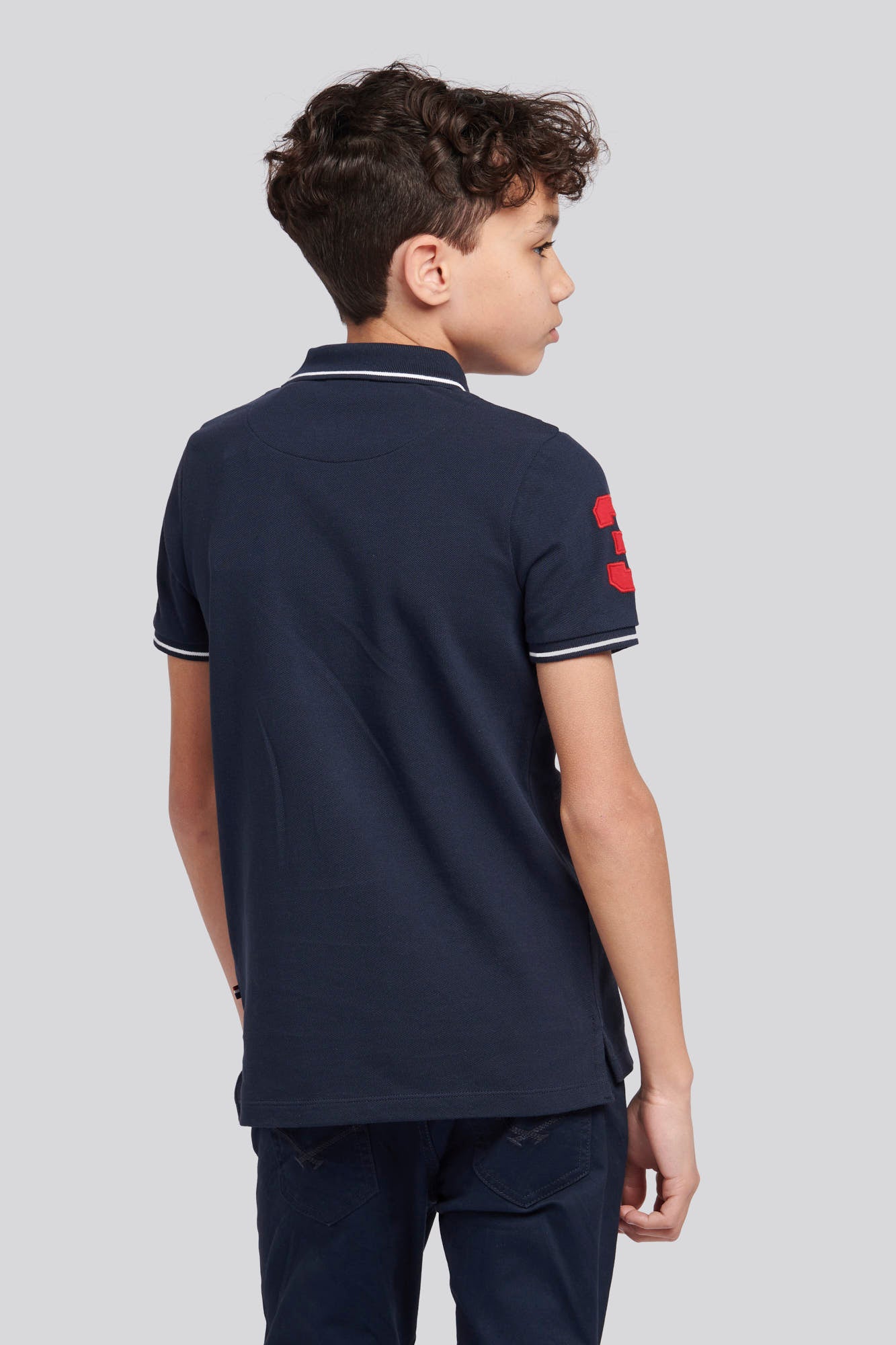 Boys Player 3 Sash Polo Shirt in Dark Sapphire Navy / Haute Red DHM