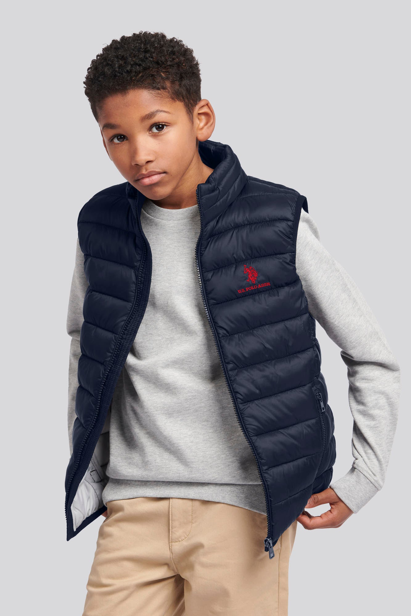 U.S. Polo Assn. Boys Bound Quilted Gilet in Dark Sapphire Navy / Haute Red DHM