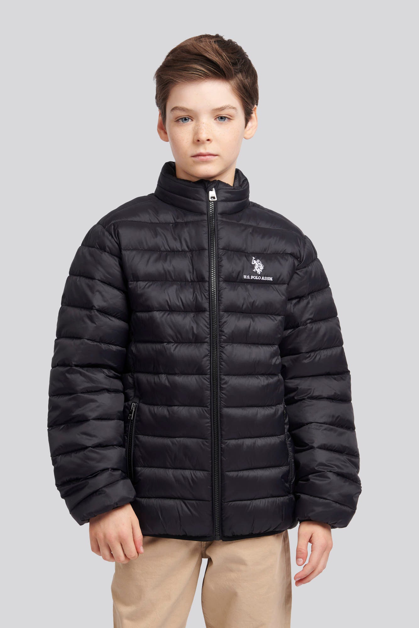 U.S. Polo Assn. Boys Lightweight Bound Quilted Jacket in Black Bright White DHM