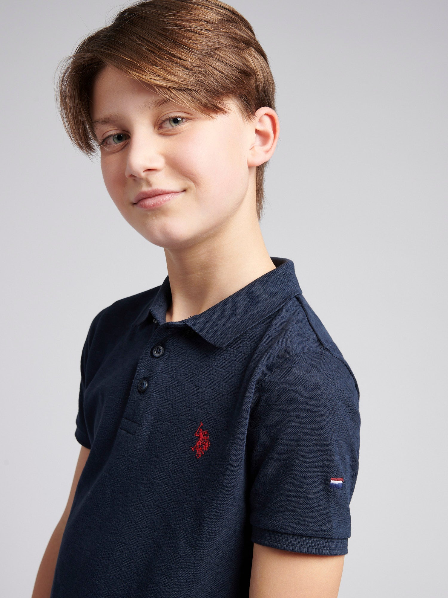 Boys Check Texture Polo Shirt in Dark Sapphire Navy / Haute Red DHM